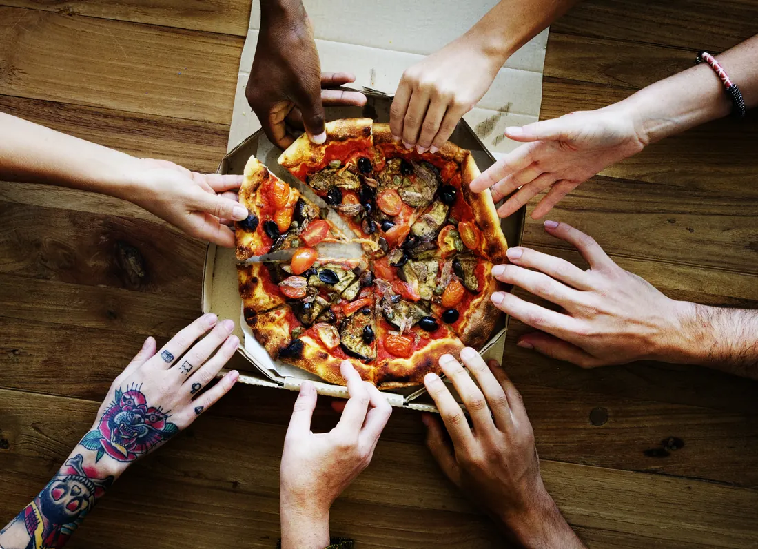 Friends sharing a pizza
